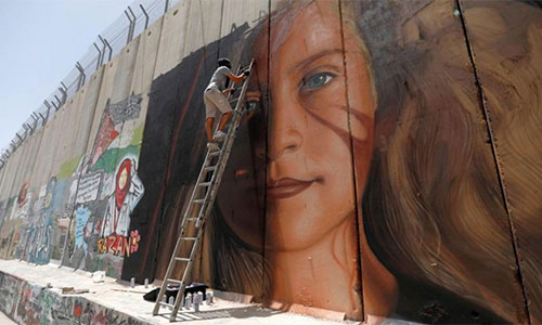 Dos artistas italianos y un palestino van a prisión por pintar el retrato de Tamimi
